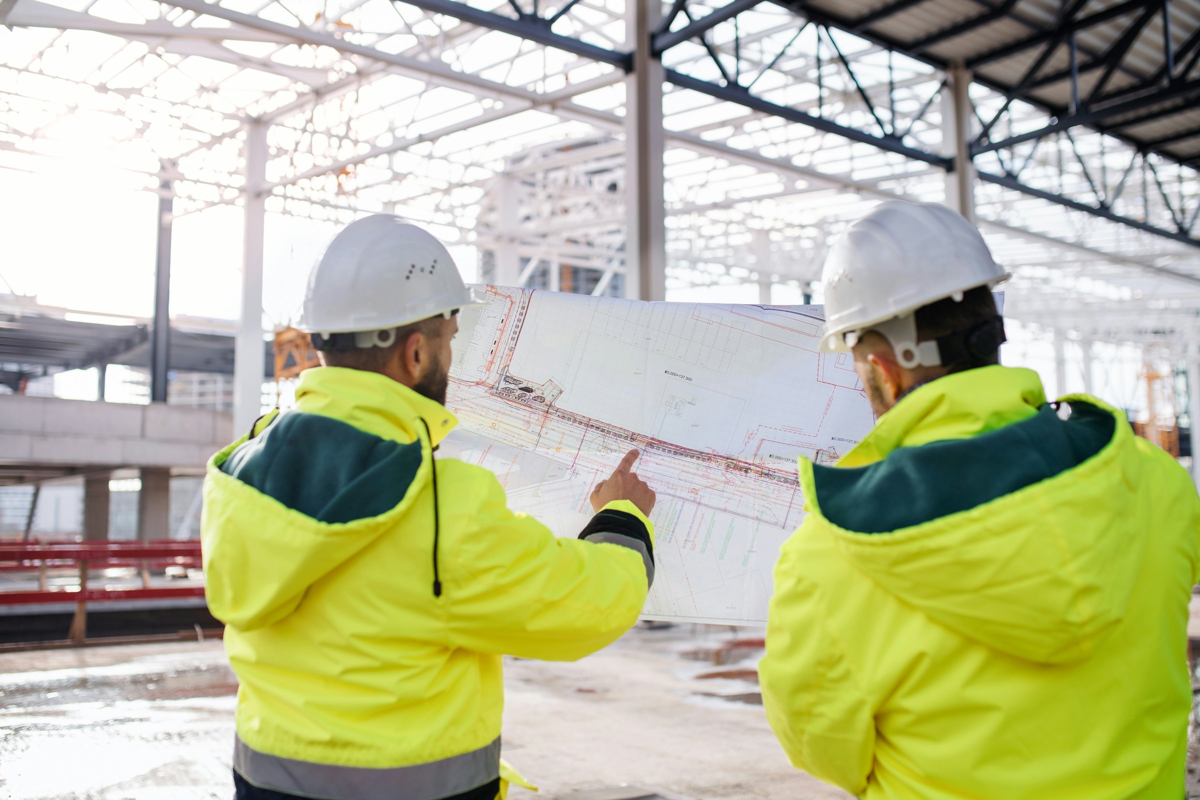 Construction and delivery team reviewing a turnkey hospital site before handover.